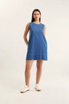 Woman wearing a blue dress on a white background