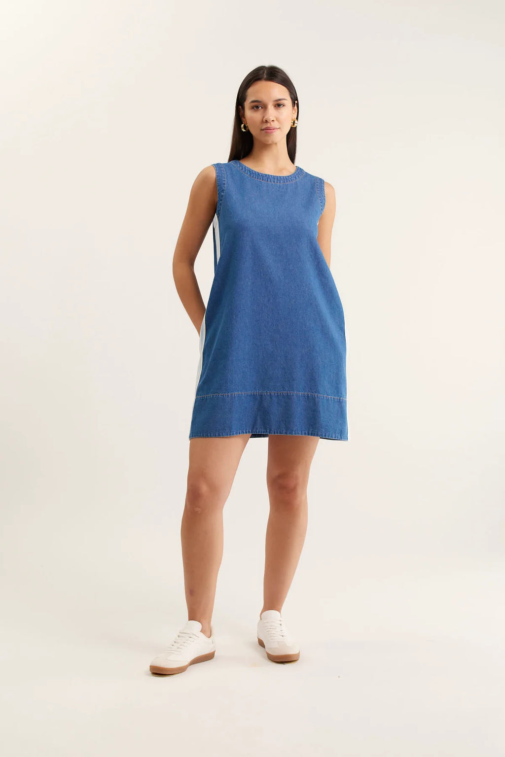 Woman wearing a blue dress on a white background