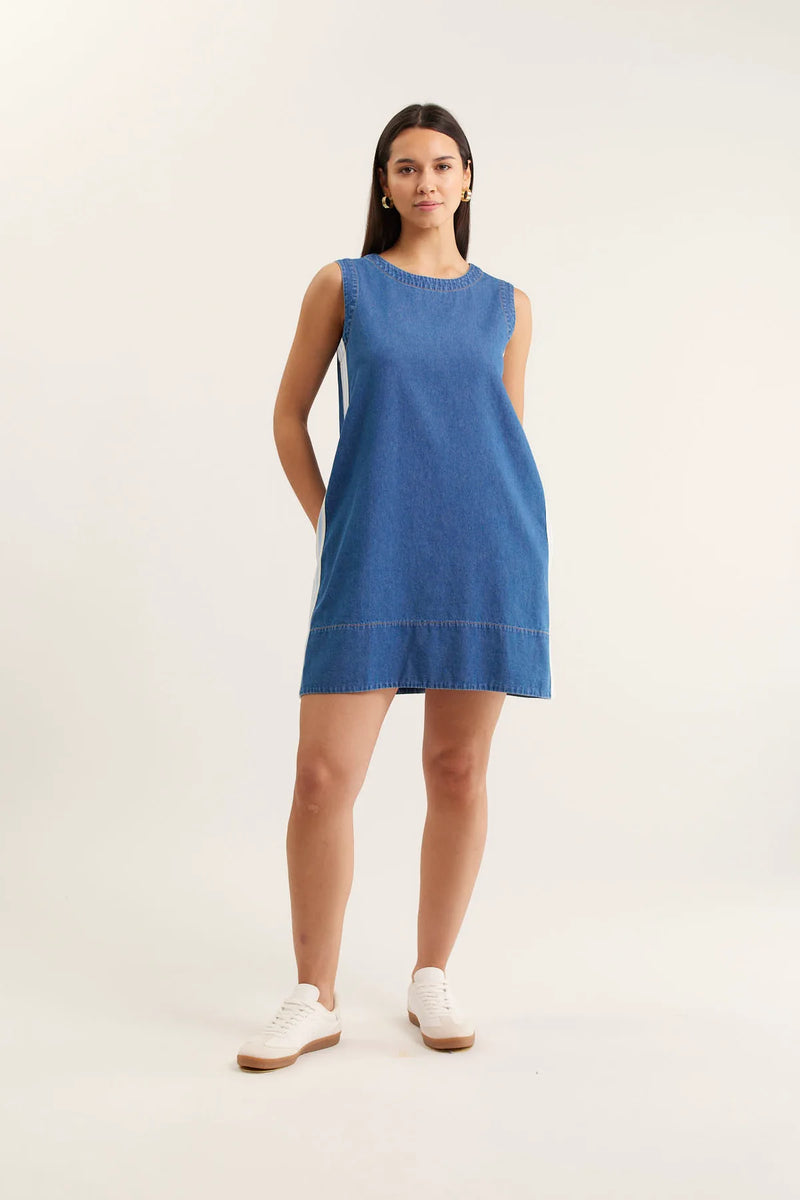 Woman wearing a blue dress on a white background
