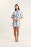 Woman wearing a floral dress on a white background