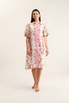 Woman wearing a floral dress with a white background