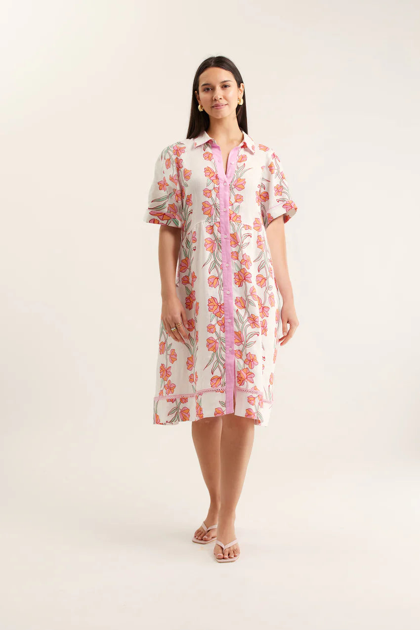 Woman wearing a floral dress with a white background