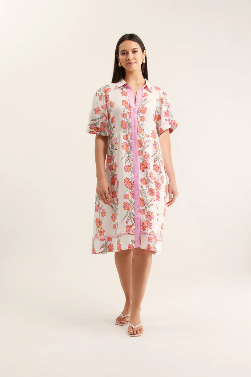 Woman wearing a floral dress with a white background