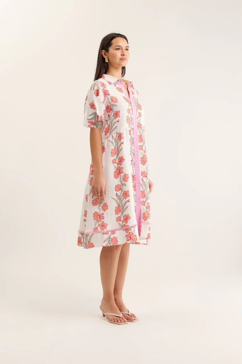 Woman wearing a floral dress on a white background