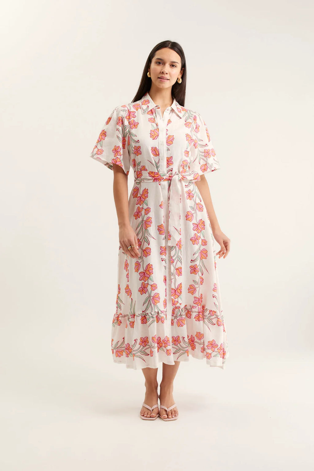 Woman wearing a floral dress on a white background
