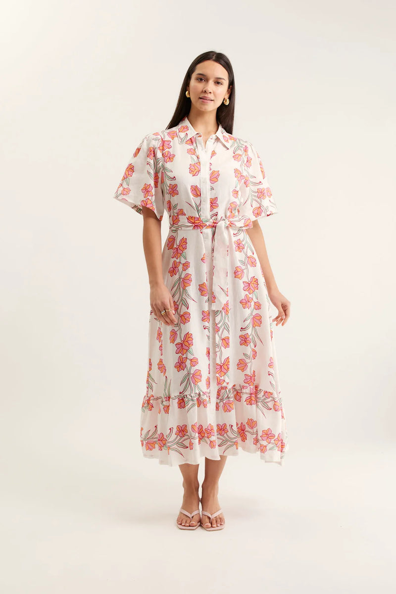 Woman wearing a floral dress on a white background