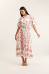 Woman wearing a floral dress on a white background