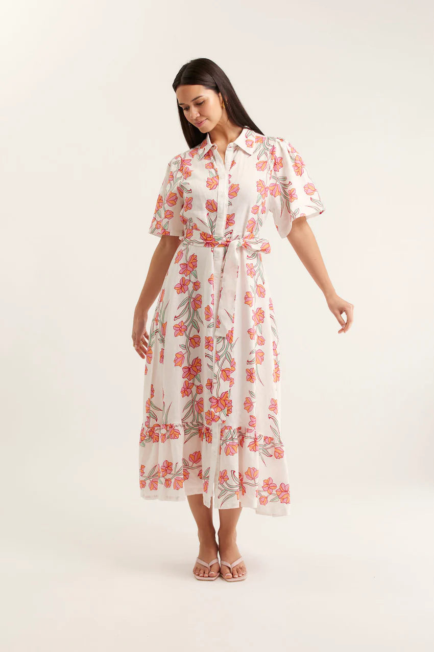 Woman wearing a floral dress on a white background