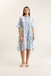 Woman wearing a floral dress on a white background