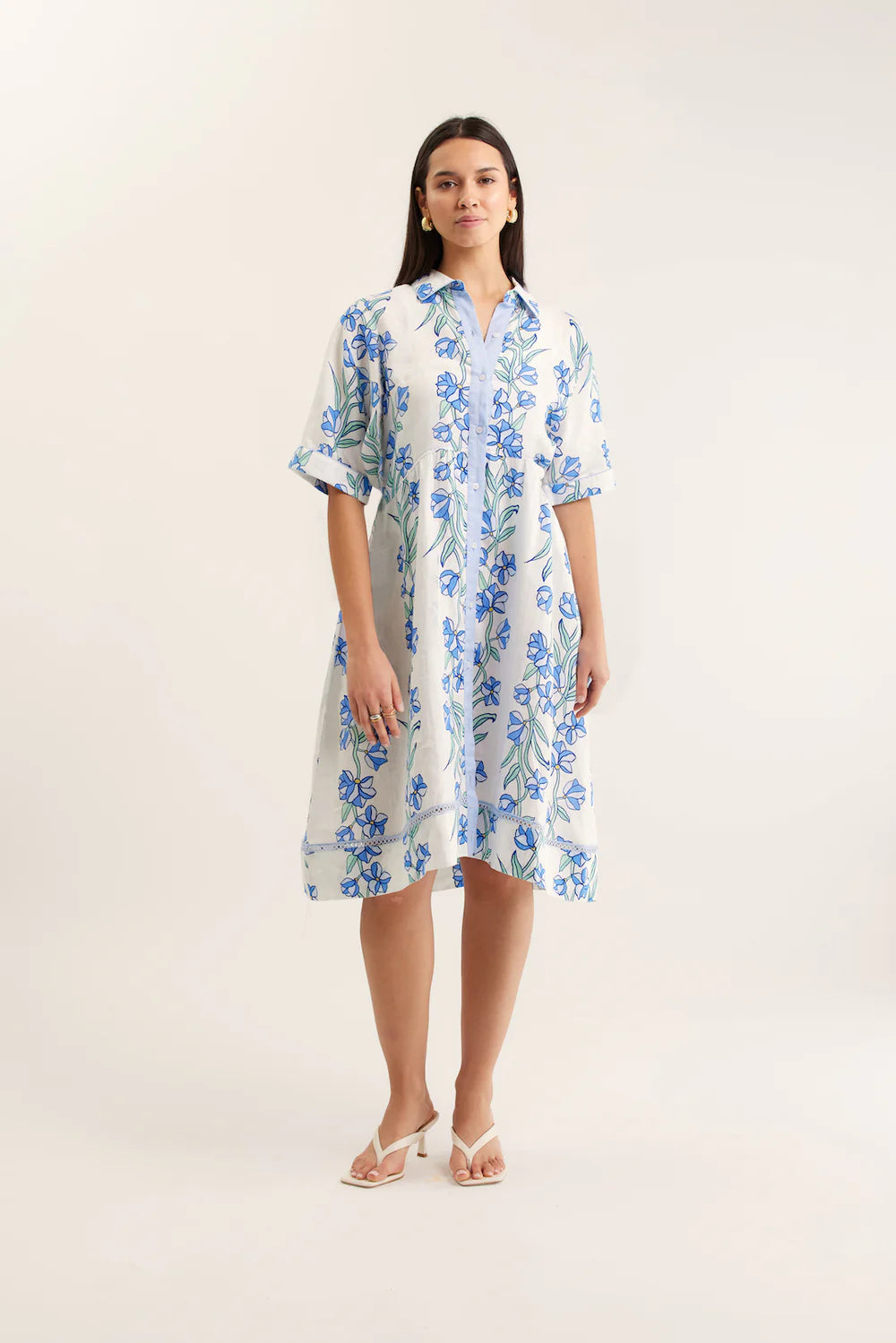 Woman wearing a floral dress on a white background