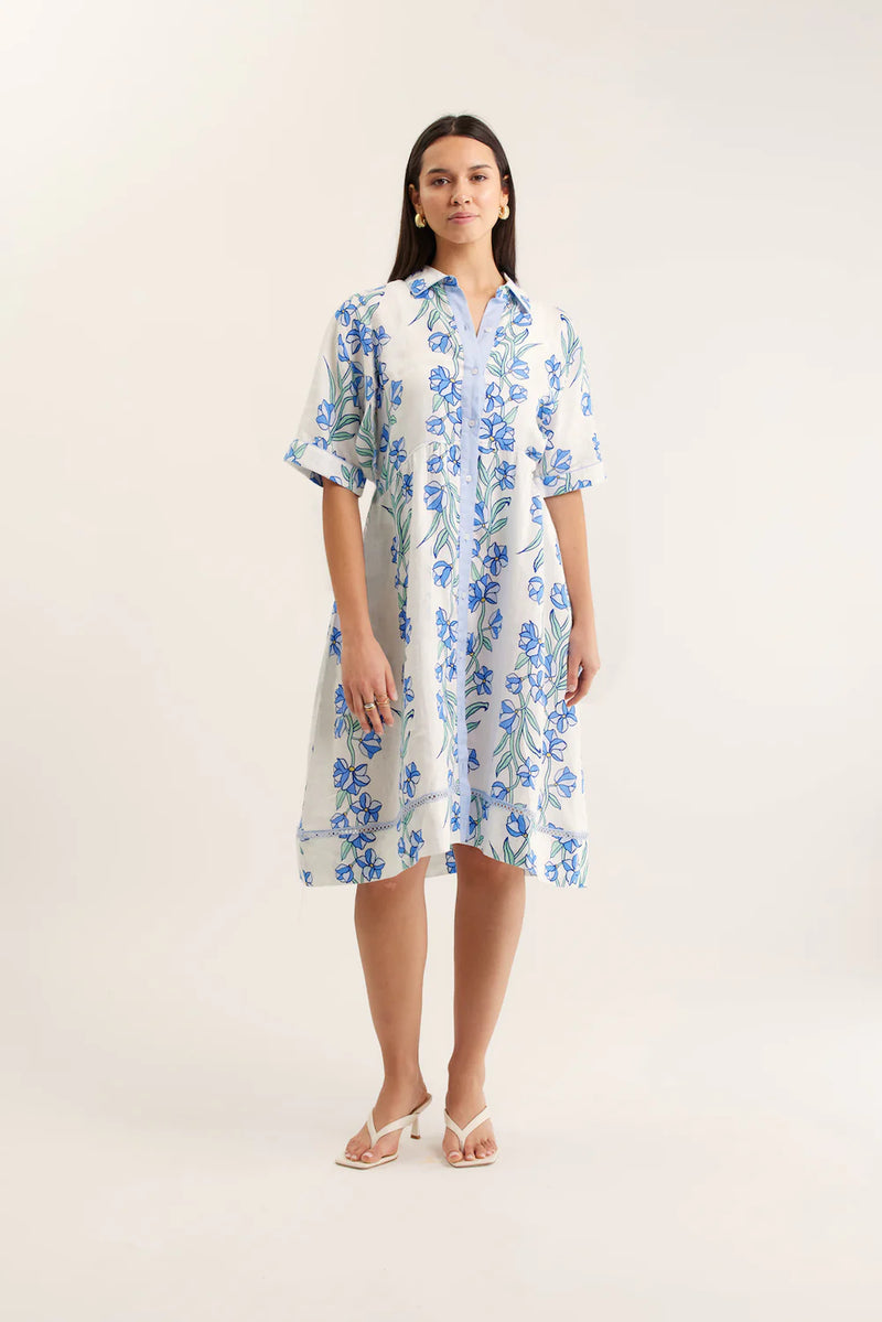 Woman wearing a floral dress on a white background