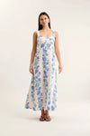 Woman wearing a floral dress on a white background