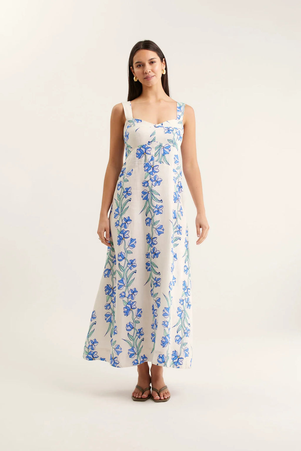 Woman wearing a floral dress on a white background