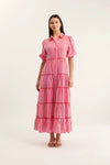 Woman wearing a red and white striped dress on a white background