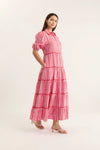 Woman wearing a red and white striped dress on a white background