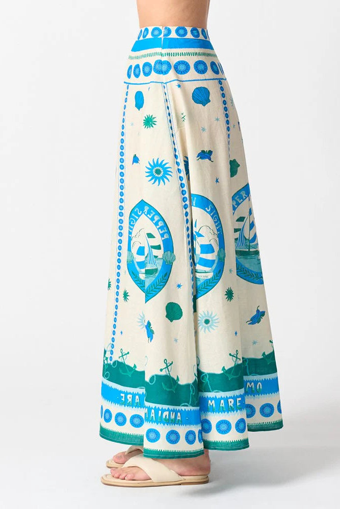 Long, patterned pants with blue and green design on a white background