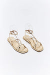Pair of clear sandal shoes on a white background