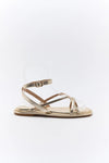 Gold sandal with clear toe cover on a white background