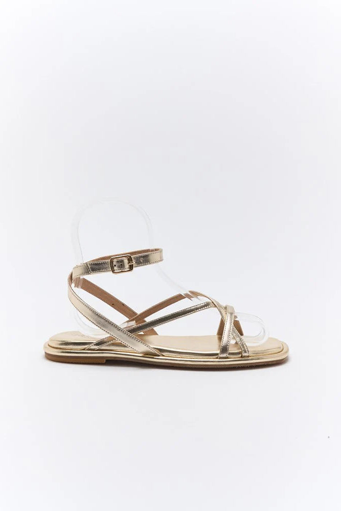 Gold sandal with clear toe cover on a white background