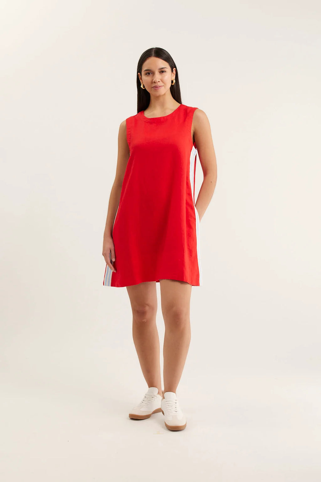 Woman wearing a red dress on a white background