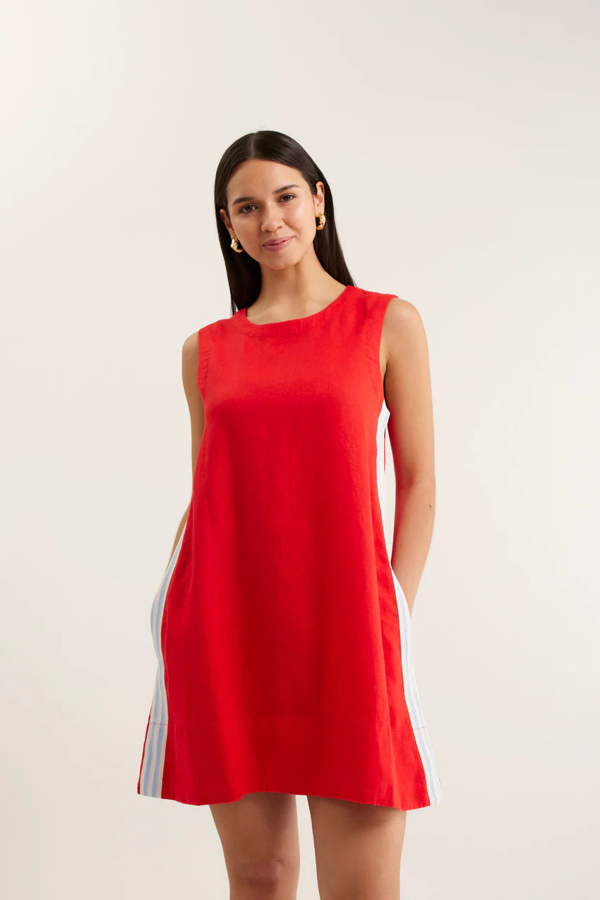 Woman wearing a red dress with a white background